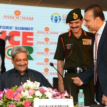 Mr. Manguirish Pai Raiker, Advisor, WTC Goa discussing with Hon'ble Defence Min. of India Shri Manohar Parrikar, 