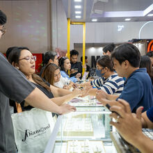 Attendees Inquiring with Exhibitors